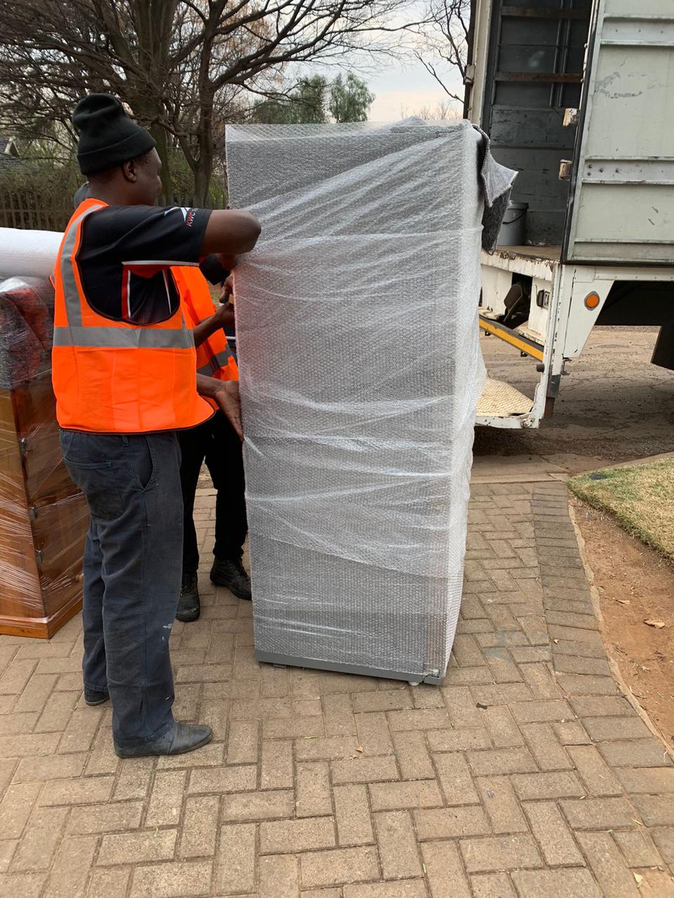 Our moving team wrapping items.